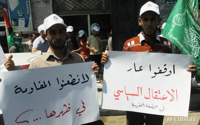 Palestinians take part a protest against political arrests by the security forces in the West Bank, Gaza City on July 11,2012. Photo by Naaman Omar