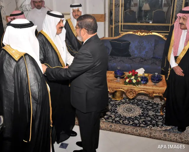Egypt's President Mohamed Mursi (C) is greeted by Saudi Princes at the Royal Palace in Jeddah airport July 11, 2012. Photo by Egyptian Presidency