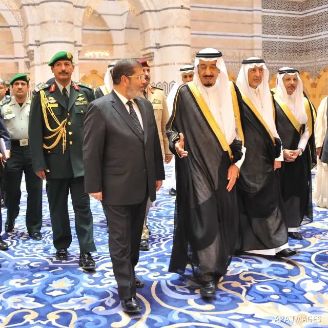 Egyptian President, Mohammed Morsi, third left, of the Muslim Brotherhood walks with Crown Prince Salman bin Abdulaziz Al Saud, third right, at the al-Salam palace in Jeddah, Saudi Arabia on July 11, 2012. Morsi has said...