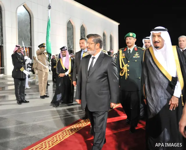 Egyptian President, Mohammed Morsi, center left, walks with Saudi Crown Prince Salman bin Abdulaziz Al Saud, center right, at the al-Salam palace in Jeddah, Saudi Arabia on uly 11, 2012. Morsi has said his administration...