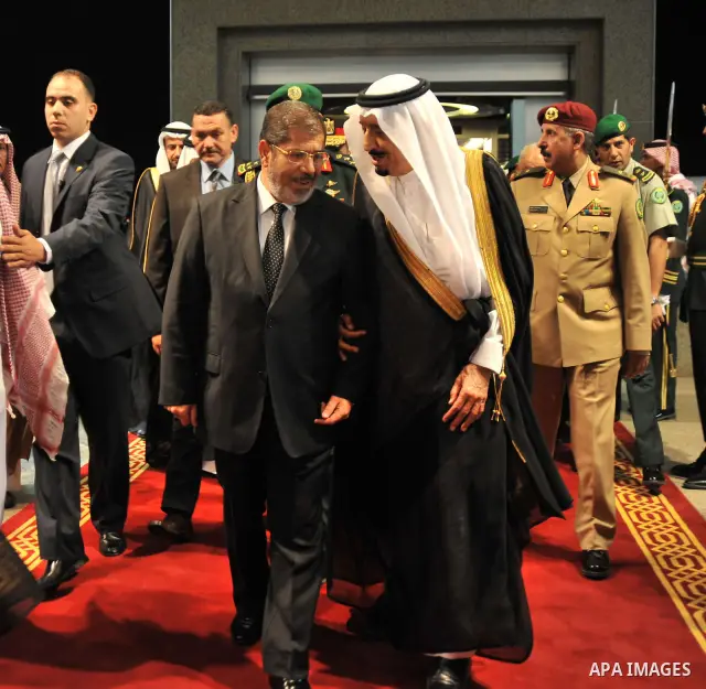 Egyptian President, Mohammed Morsi, center left, walks with Saudi Crown Prince Salman bin Abdulaziz Al Saud, center right, at the al-Salam palace in Jeddah, Saudi Arabia on uly 11, 2012. Morsi has said his administration...