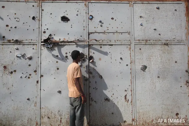 Palestinians inspect a destroyed vehicle following an Israeli bombing in Gaza City on July 12, 2012. A Palestinian was killed and others wounded after an Israeli air strike in al-Zeitoun area in the east of Gaza city on...