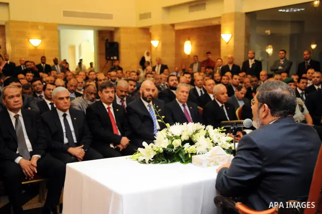Egyptian President Mohamed Morsi meeting with the Egyptian community in Saudi Arabia at the Egyptian consulate in Jeddah, Saudi Arabia, 12 July 2012. Egyptian President Morsi arrived 11 July in Saudi Arabia on his first...