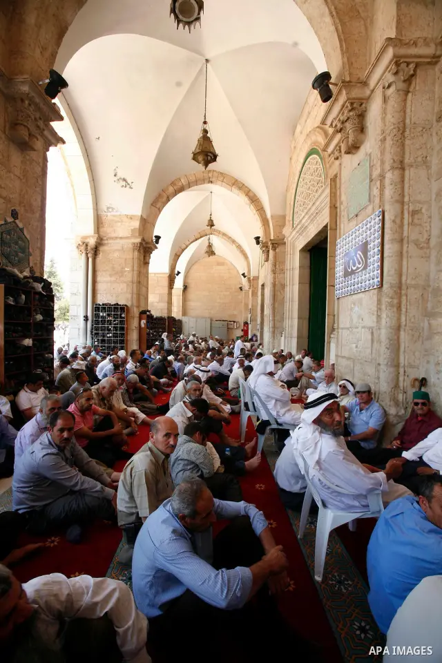 Palestinian Muslim worshippers participate Friday prayers, at the al-Aqsa Mosque compound, in Jerusalem's old city on July 13, 2012. Photo by Mahfouz Abu Turk