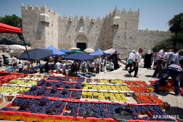A Palestinian vendor displays his goods following Friday prayers, in the old city of Jerusalem on July 13, 2012. Photo by Mahfouz Abu Turk