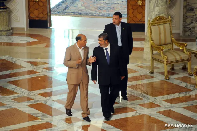 Egyptian President Mohamed Morsi (L) greeting Tunisian President Moncef Marzouki (R) at the presidential palace, in Cairo, Egypt, 13 July 2012. Marzouki is the first head of state to meet with Morsi in Cairo since he was...
