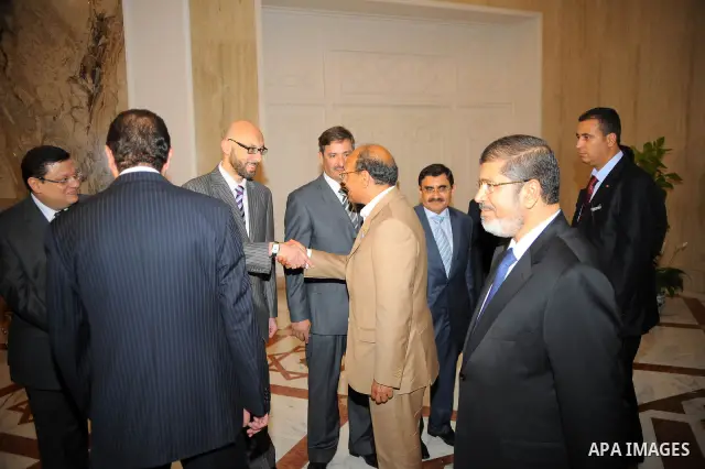 Egyptian President Mohamed Morsi (L) greeting Tunisian President Moncef Marzouki (R) at the presidential palace, in Cairo, Egypt, 13 July 2012. Marzouki is the first head of state to meet with Morsi in Cairo since he was...
