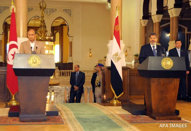 Egyptian President Mohamed Morsi (R) and his Tunisian counterpart Moncef Marzouki (L) attend a joint press conference at the Presidential Palace in Cairo on July 13, 2012. The post-uprising presidents of Egypt and Tunisi...