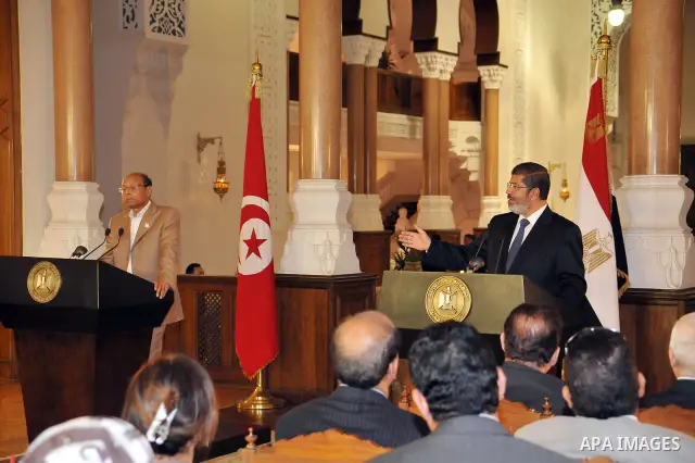 Egyptian President Mohamed Morsi (R) and his Tunisian counterpart Moncef Marzouki (L) attend a joint press conference at the Presidential Palace in Cairo on July 13, 2012. The post-uprising presidents of Egypt and Tunisi...