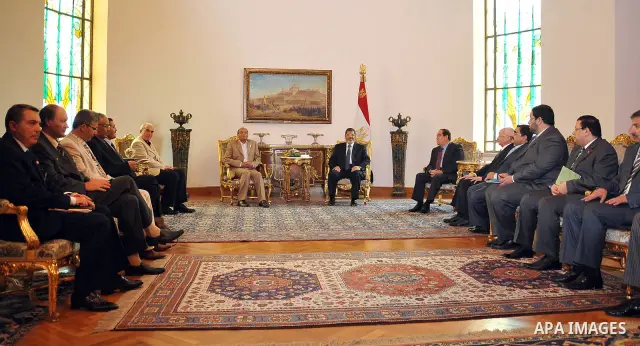 Tunisian President Moncef Marzouki, left, meets with Egyptian President Mohammed Morsi, right, at the Presidential palace in Cairo, Egypt, Friday, July 13, 2012. The presidents of Egypt and Tunisia pledge to open a new c...