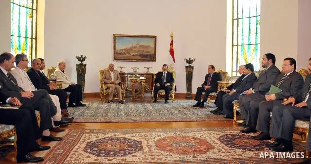 Tunisian President Moncef Marzouki, left, meets with Egyptian President Mohammed Morsi, right, at the Presidential palace in Cairo, Egypt, Friday, July 13, 2012. The presidents of Egypt and Tunisia pledge to open a new c...