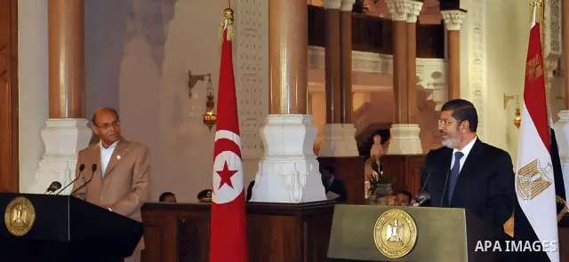Egyptian President Mohamed Morsi (R) and his Tunisian counterpart Moncef Marzouki (L) attend a joint press conference at the Presidential Palace in Cairo on July 13, 2012. The post-uprising presidents of Egypt and Tunisi...