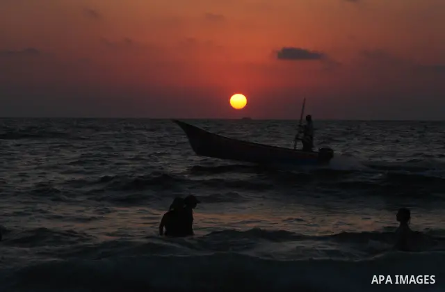 Palestinians enjoy swimming in the sea at Gaza beach on 13 July 2012 in Gaza City. Photo by Majdi Fathi