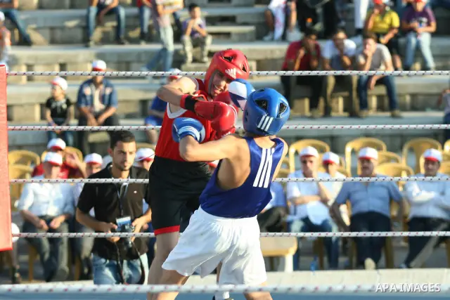 Palestinian boxing players fight during a friendly match in the West Bank city of Nablus, on 13 July 2012. Palestinian boxing union built a new international racetrack in Nablus. Photo by Nedal Eshtayah