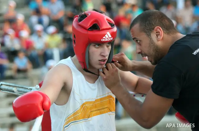 Palestinian boxing players fight during a friendly match in the West Bank city of Nablus, on 13 July 2012. Palestinian boxing union built a new international racetrack in Nablus. Photo by Nedal Eshtayah