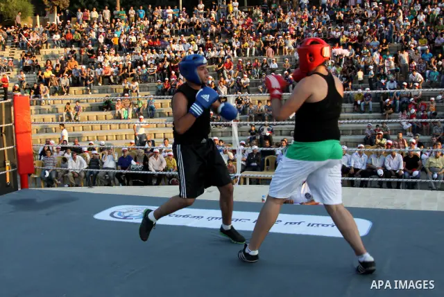 Palestinian boxing players fight during a friendly match in the West Bank city of Nablus, on 13 July 2012. Palestinian boxing union built a new international racetrack in Nablus. Photo by Nedal Eshtayah