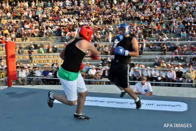 Palestinian boxing players fight during a friendly match in the West Bank city of Nablus, on 13 July 2012. Palestinian boxing union built a new international racetrack in Nablus. Photo by Nedal Eshtayah