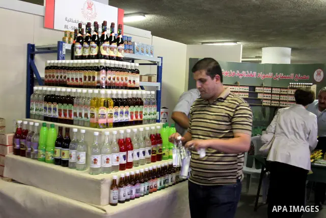 Palestinians participate in the opening of festival national products in the West Bank city of Nablus, on July, 14, 2012. Photo by Nedal Eshtayah
