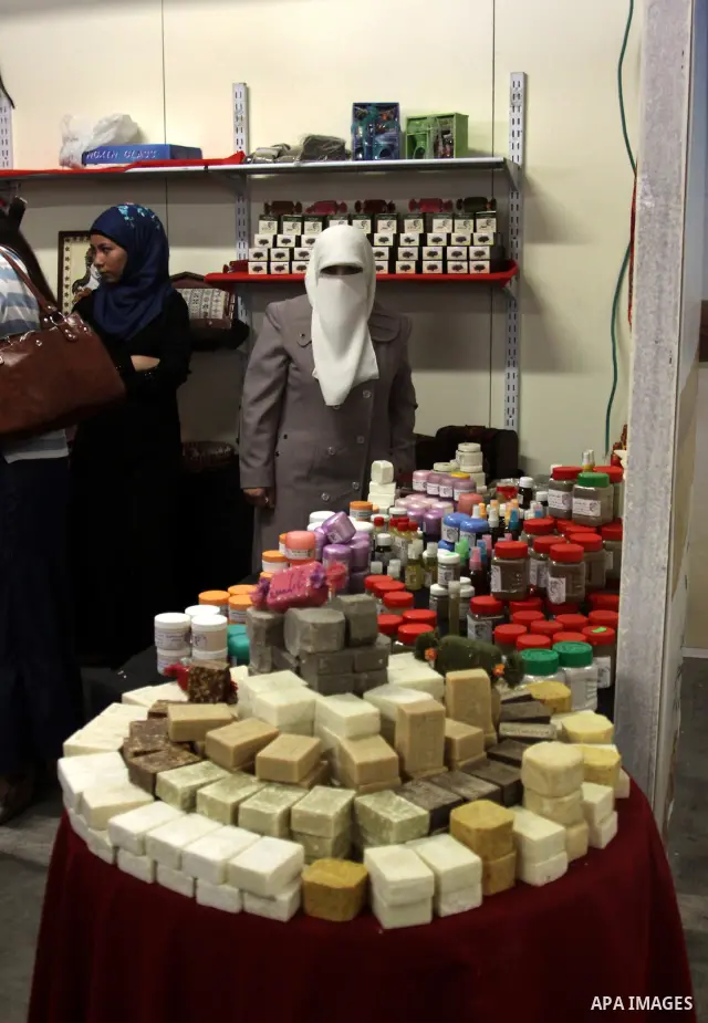 Palestinians participate in the opening of festival national products in the West Bank city of Nablus, on July, 14, 2012. Photo by Nedal Eshtayah