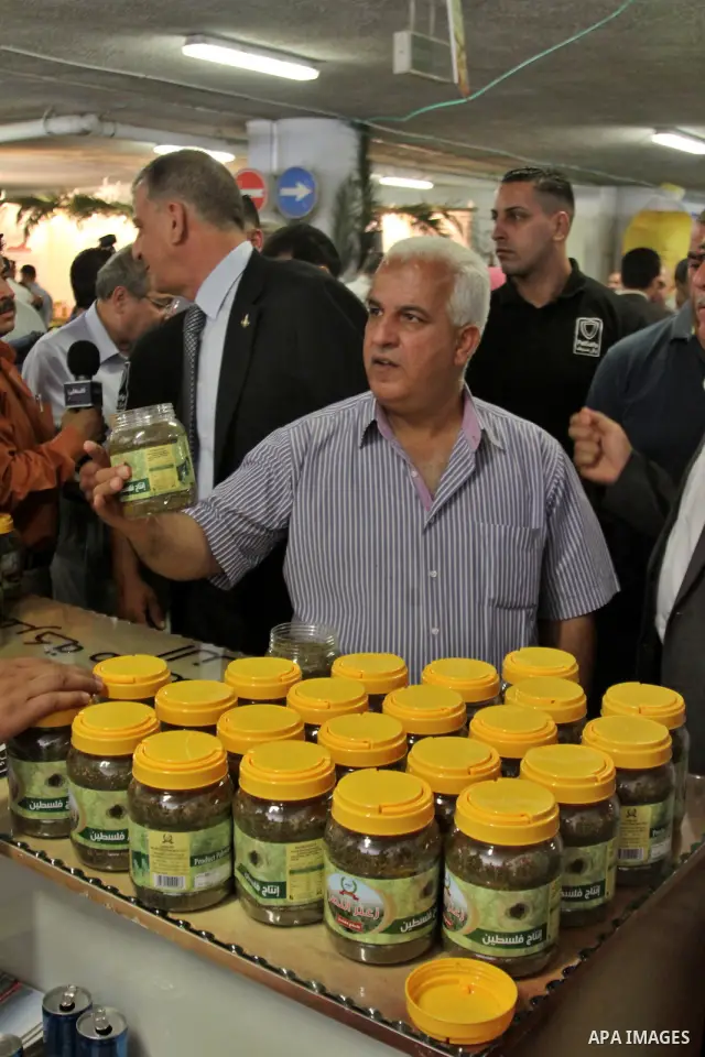 Palestinians participate in the opening of festival national products in the West Bank city of Nablus, on July, 14, 2012. Photo by Nedal Eshtayah