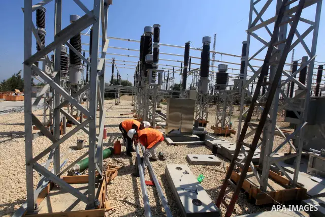 Palestinians workers work in energy company during maintenance work in Gaza city, on July 14, 2012. Photo by Majdi Fathi