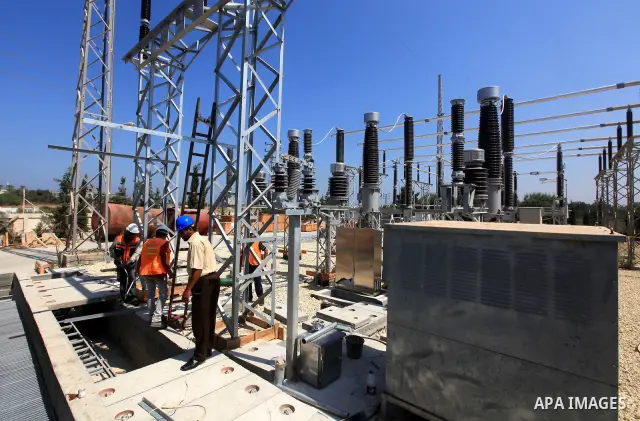 Palestinians workers work in energy company during maintenance work in Gaza city, on July 14, 2012. Photo by Majdi Fathi
