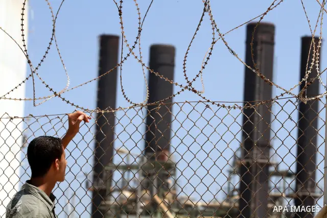 Palestinians workers work in energy company during maintenance work in Gaza city, on July 14, 2012. Photo by Majdi Fathi