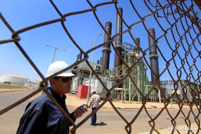 Palestinians workers work in energy company during maintenance work in Gaza city, on July 14, 2012. Photo by Majdi Fathi