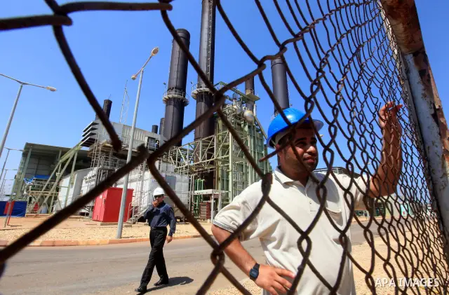 Palestinians workers work in energy company during maintenance work in Gaza city, on July 14, 2012. Photo by Majdi Fathi