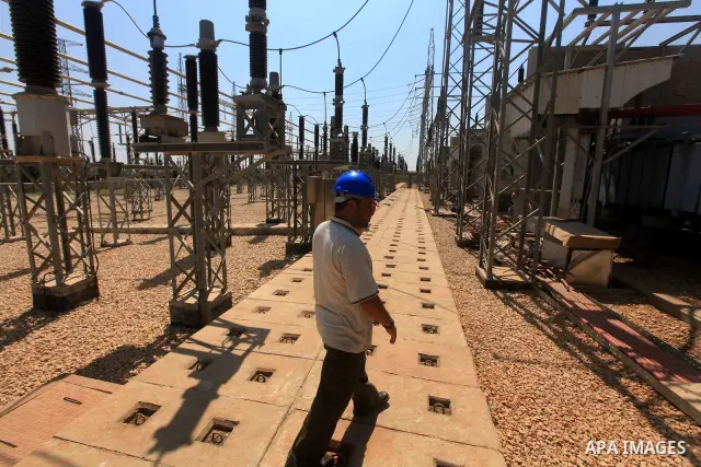 Palestinians workers work in energy company during maintenance work in Gaza city, on July 14, 2012. Photo by Majdi Fathi