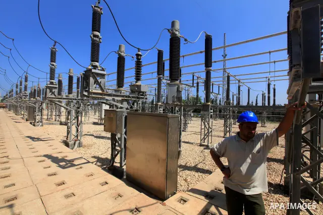 Palestinians workers work in energy company during maintenance work in Gaza city, on July 14, 2012. Photo by Majdi Fathi