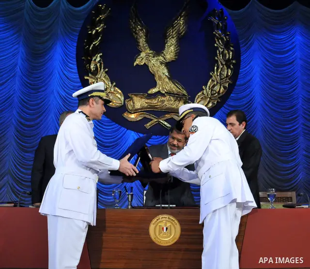 In this image released by the Egyptian Presidency, Egyptian President, Mohammed Morsi at a graduation ceremony at the Police Academy headquarters in Cairo, Egypt, July 14, 2012. The Police Academy was also the venue for...