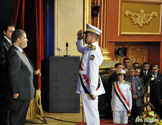 In this image released by the Egyptian Presidency, Egyptian President, Mohammed Morsi at a graduation ceremony at the Police Academy headquarters in Cairo, Egypt, July 14, 2012. The Police Academy was also the venue for...
