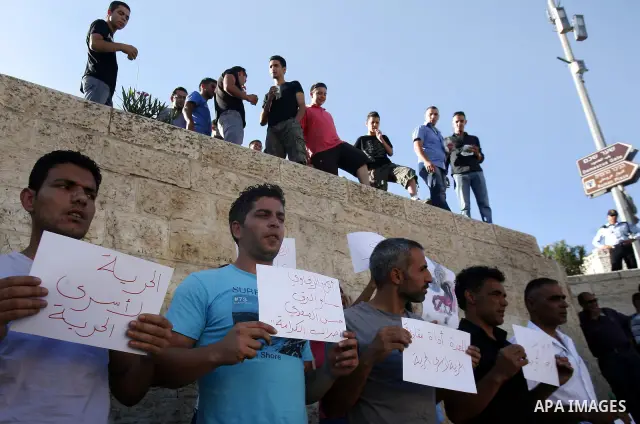 Palestinians take part a protest to calling of release of palestinian prisoners in Israeli jails whose are still refusing food for after a deal was made to end a mass prisoner hunger strike, during a demonstration in the...