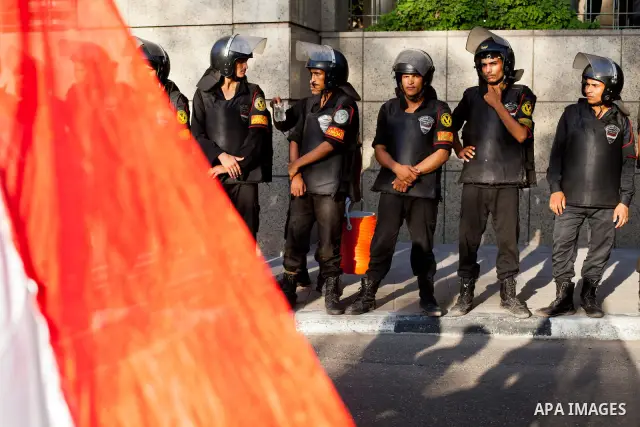 July 14, 2012 - Cairo, Egypt - Police officers guard the entrance of the Four Seasons Hotel, where US Secretary of State Hillary Clinton resides for her visit to Egypt. Egyptians surrounded the hotel entrance, protesting...