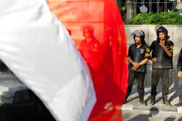 July 14, 2012 - Cairo, Egypt - Police officers guard the entrance of the Four Seasons Hotel, where US Secretary of State Hillary Clinton resides for her visit to Egypt. Egyptians surrounded the hotel entrance, protesting...