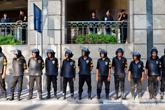 July 14, 2012 - Cairo, Egypt - Police officers guard the entrance of the Four Seasons Hotel, where US Secretary of State Hillary Clinton resides for her visit to Egypt. Egyptians surrounded the hotel entrance, protesting...