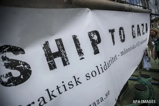 July 13, 2012 - Stockholm, Stockholm, Sweden - A Swedish pro-Palestinian supporter at the Skeppsbron port in Stockholm, where the humanitarian aid ship ''Estelle'' is ready to sets sail. The ship is part of a pro-palesti...