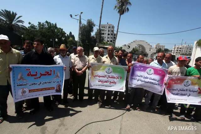 Palestinian trade unions and members legislative council participate a protest against political arrests by the security forces in the West Bank, Gaza City on July 15, 2012. Photo by Ashraf Amra