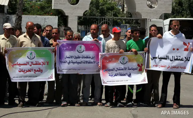 Palestinian trade unions and members legislative council participate a protest against political arrests by the security forces in the West Bank, Gaza City on July 15, 2012. Photo by Ashraf Amra