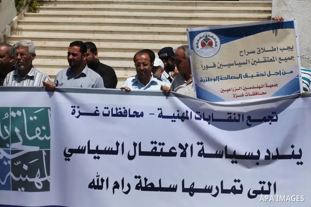 Palestinian trade unions and members legislative council participate a protest against political arrests by the security forces in the West Bank, Gaza City on July 15, 2012. Photo by Ashraf Amra