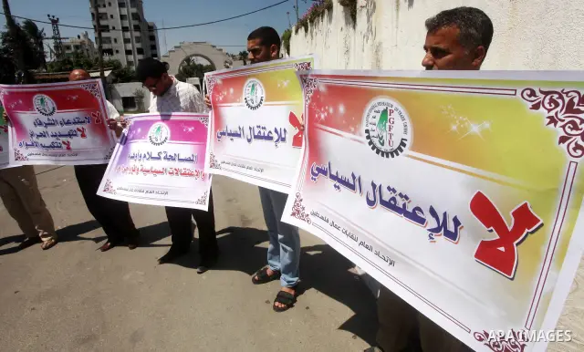 Palestinian trade unions and members legislative council participate a protest against political arrests by the security forces in the West Bank, Gaza City on July 15, 2012. Photo by Ashraf Amra