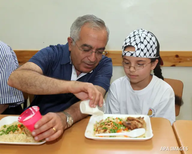 Palestinian Prime Minister Salam Fayyad visits "Palestine in sons of the martyrs eyes" summer camp, in the West Bank city of Jenin, al-Fari'ah refugee camp, on July 15, 2012. Photo by Mustafa Abu Dayeh