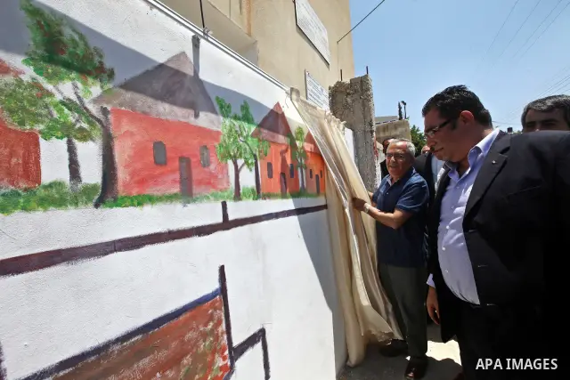Palestinian Prime Minister Salam Fayyad attends the closing ceremony of "Protection of the Environment" summer camp, organised by Palestinian Water Authority in the West Bank, southern Nablus, village of Biddya, on July...