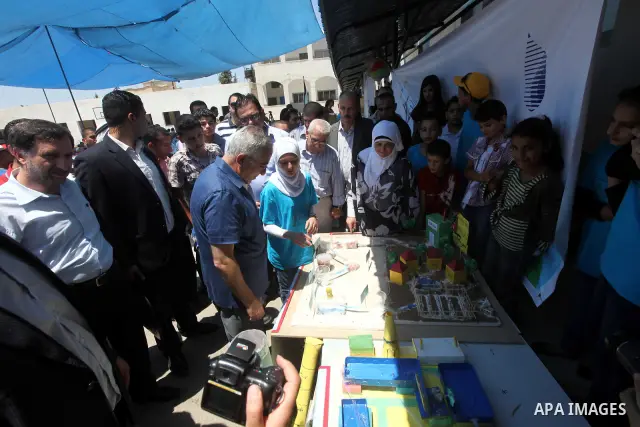 Palestinian Prime Minister Salam Fayyad attends the closing ceremony of "Protection of the Environment" summer camp, organised by Palestinian Water Authority in the West Bank, southern Nablus, village of Biddya, on July...