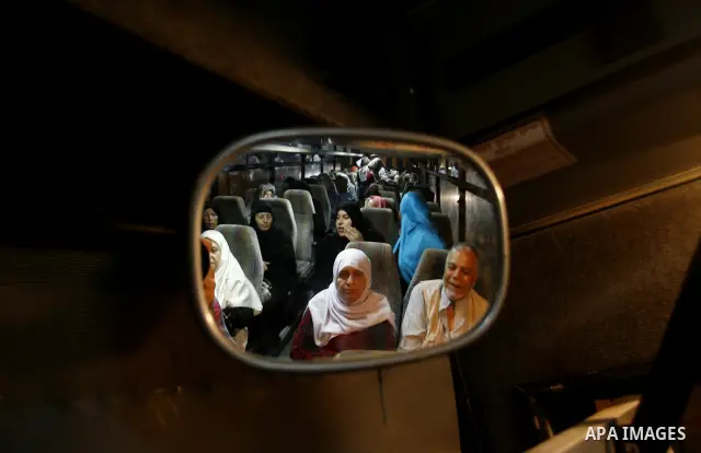 Family members of Palestinian prisoners on their way to visit their relatives jailed in Israel sit in a bus before it leaves Gaza City July 16, 2012. Israel on Monday allowed Palestinian families from the Gaza Strip to v...