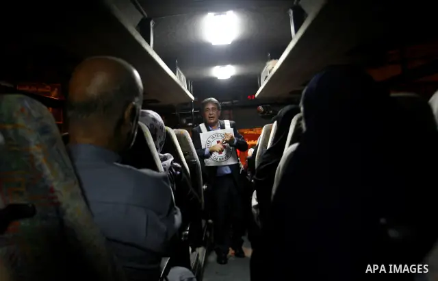Family members of Palestinian prisoners on their way to visit their relatives jailed in Israel sit in a bus before it leaves Gaza City July 16, 2012. Israel on Monday allowed Palestinian families from the Gaza Strip to v...