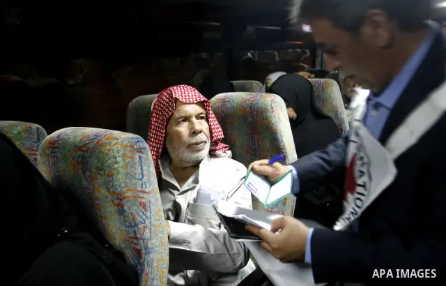 Family members of Palestinian prisoners on their way to visit their relatives jailed in Israel sit in a bus before it leaves Gaza City July 16, 2012. Israel on Monday allowed Palestinian families from the Gaza Strip to v...