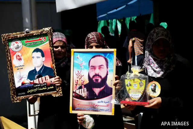 Palestinian relatives prisoners attend a protest calling for the release of their sons held in Israeli jails in front of the headquarters Red Cross in Gaza City, Gaza Strip, on July.16, 2012. Photo by Ashraf Amra