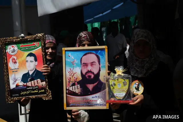 Palestinian relatives prisoners attend a protest calling for the release of their sons held in Israeli jails in front of the headquarters Red Cross in Gaza City, Gaza Strip, on July.16, 2012. Photo by Ashraf Amra